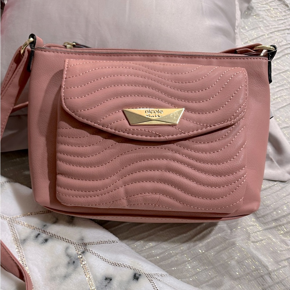 Multiple different brand handbags. Various colors with multiple pockets.